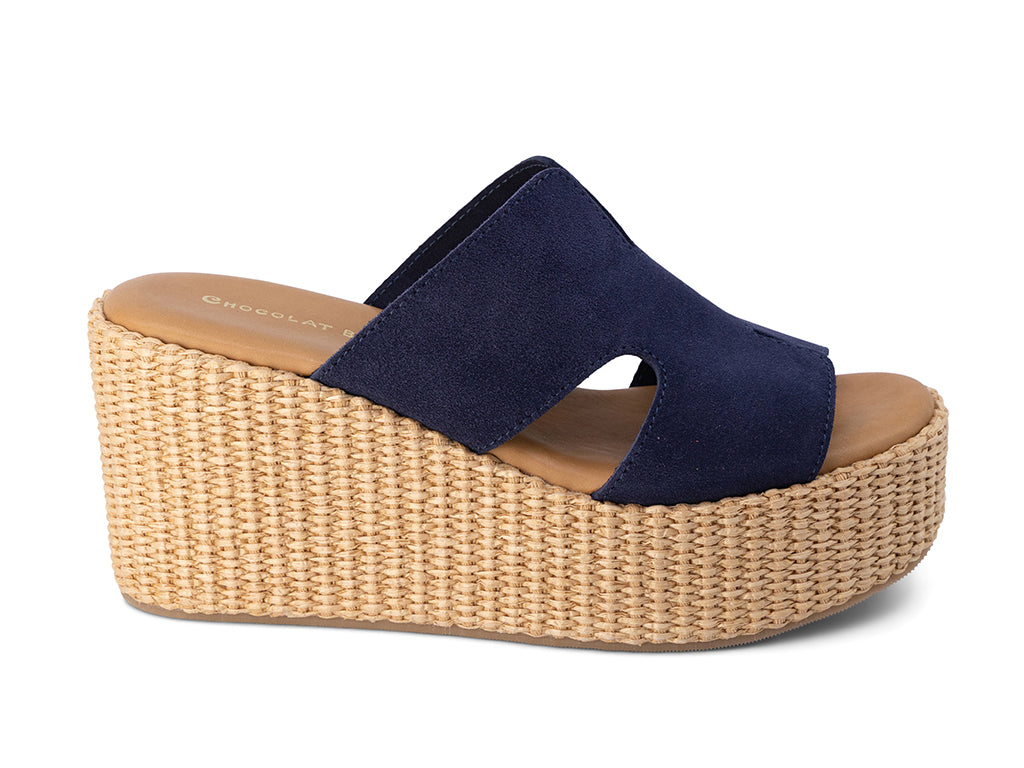 Navy wedge sandal with woven platform on a white background