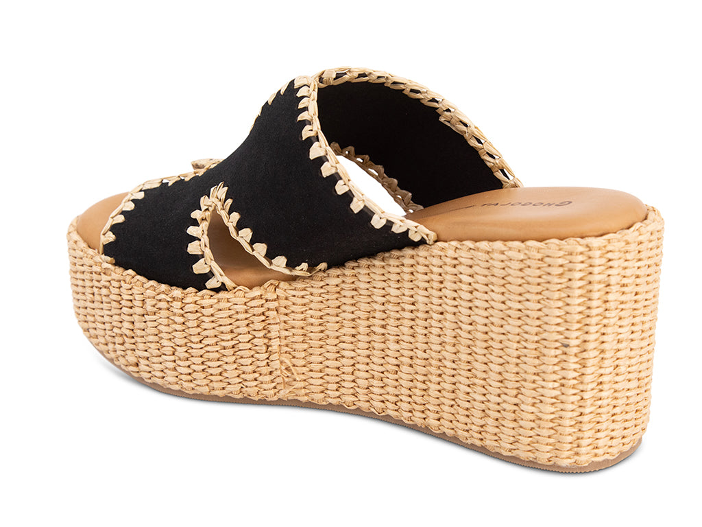 black suede slide sandal on a raffia wrapped wedge - view from the back