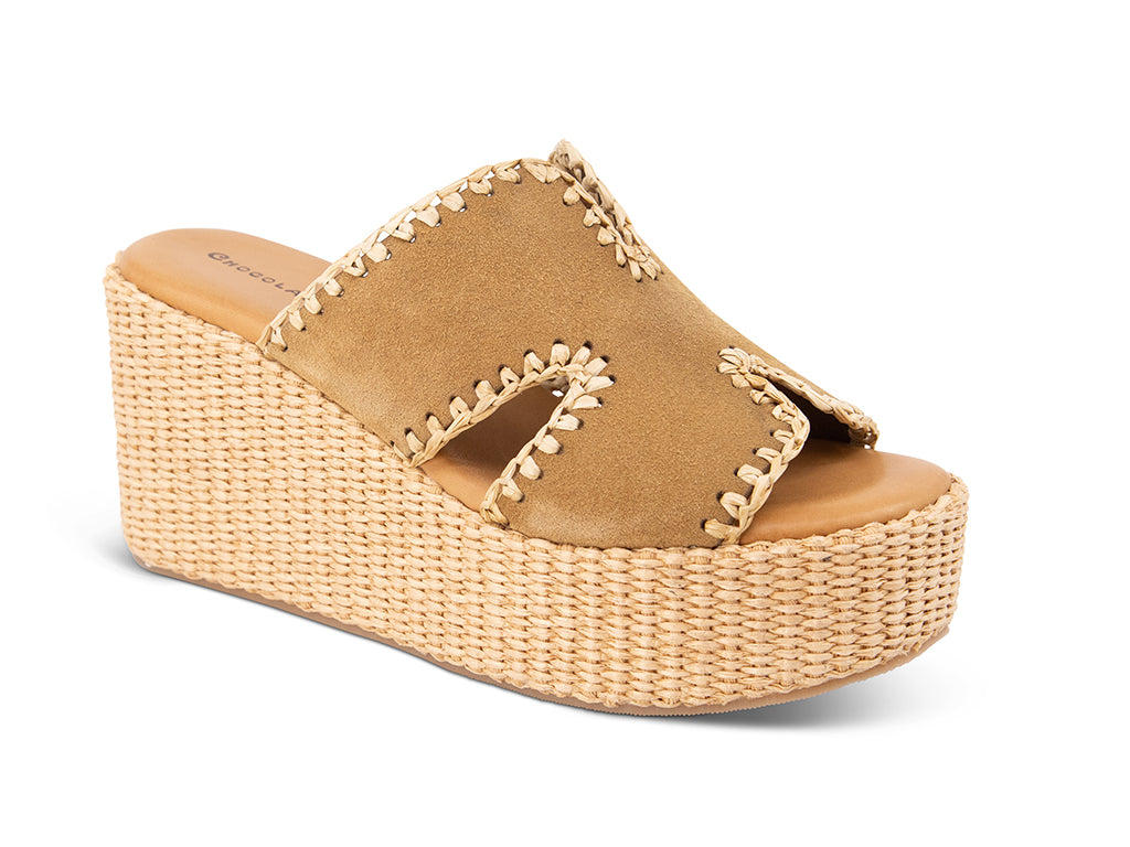 camel suede slide sandal on a raffia wrapped wedge