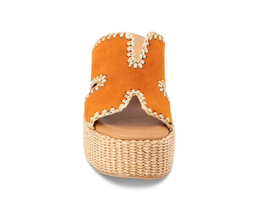 orange suede slide sandal on a raffia wrapped wedge - view from the front