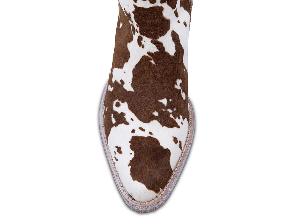 brown and white patterned calf hair ankle boot with a low block heel and a pull tab at the top - view of the toe shape