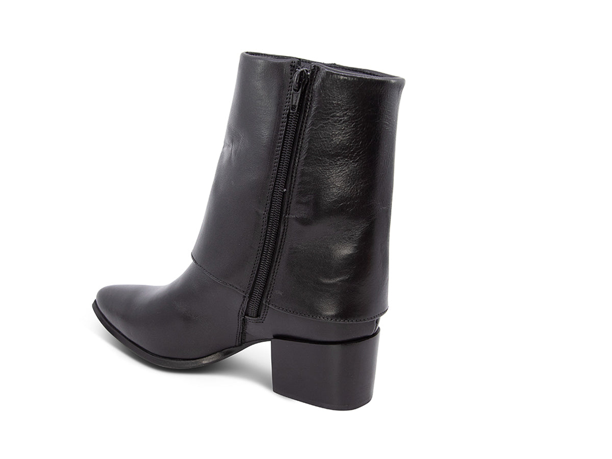 Black leather boot with a gold side zipper and overlap design on a white background side angle view