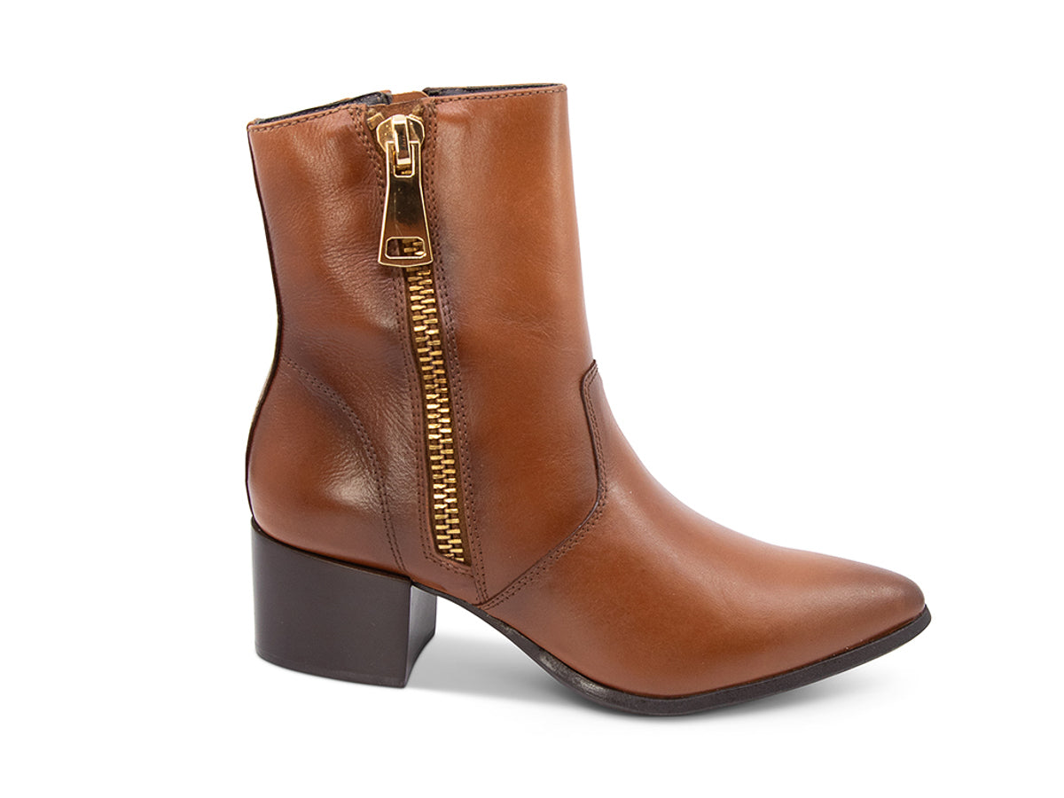 Brown ankle boot with gold zipper on a white background side view