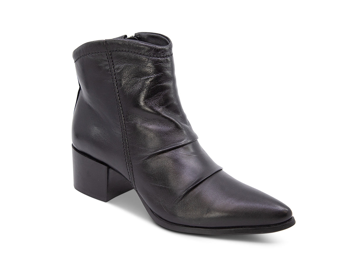 Black leather ankle boot on a white background side angle view