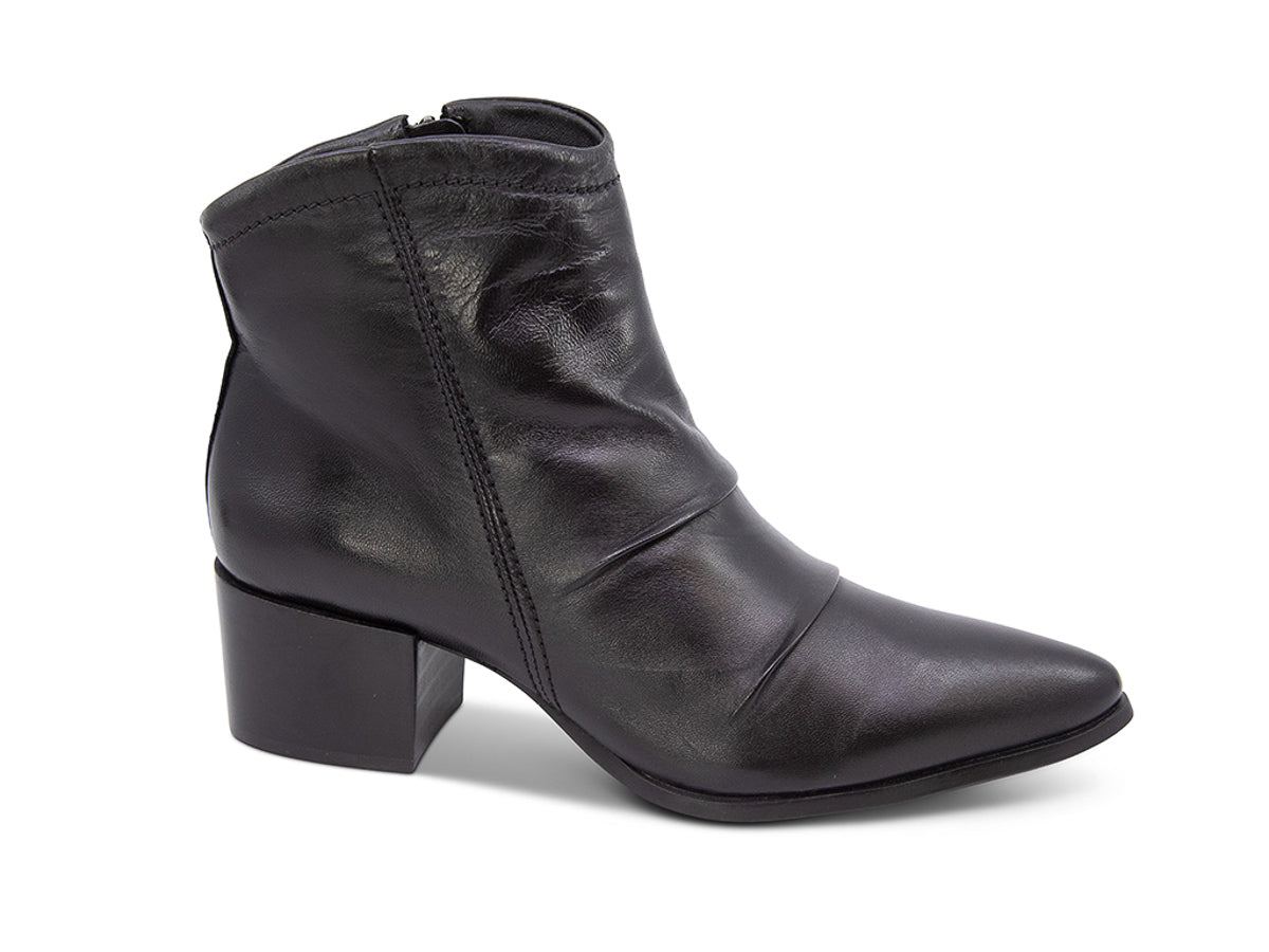 Black leather ankle boot on a white background side view