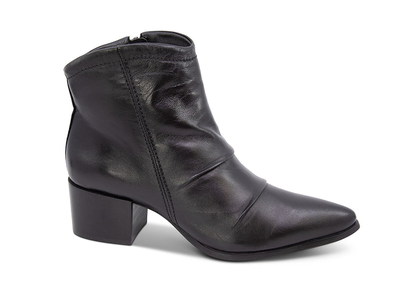 Black leather ankle boot on a white background side view