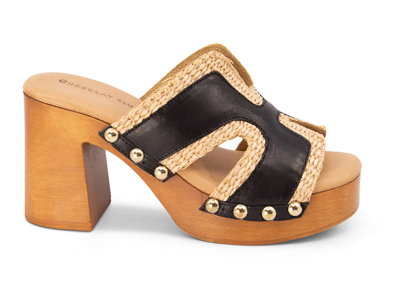 brown slide sandal on a high wooden platform with raffia and black leather upper - side view