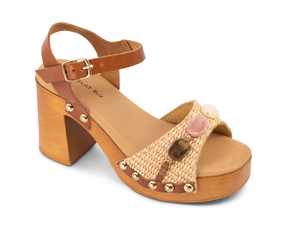 raffia upper sandal with stone details on a wooden platform 