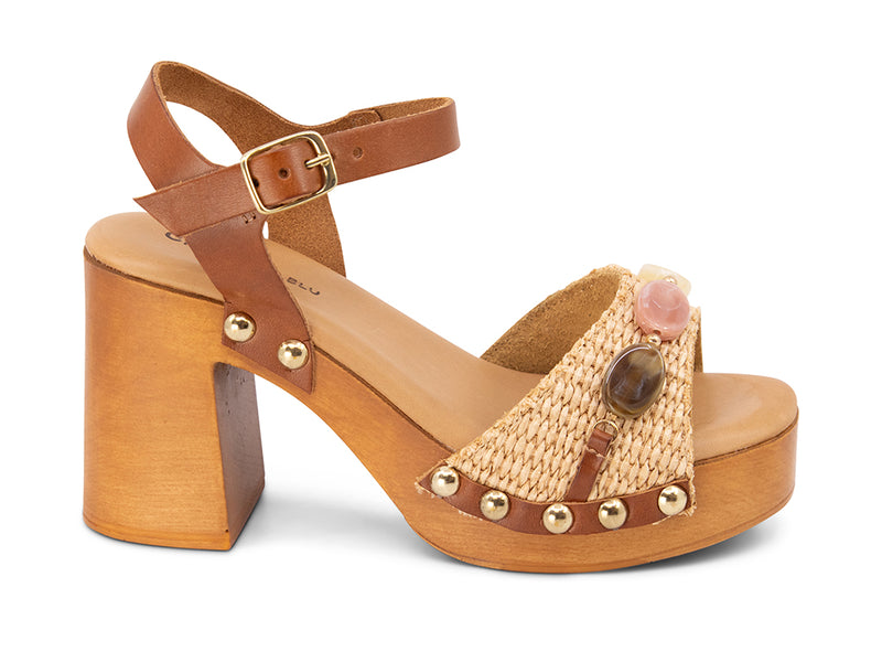 raffia upper sandal with stone details on a wooden platform - side view