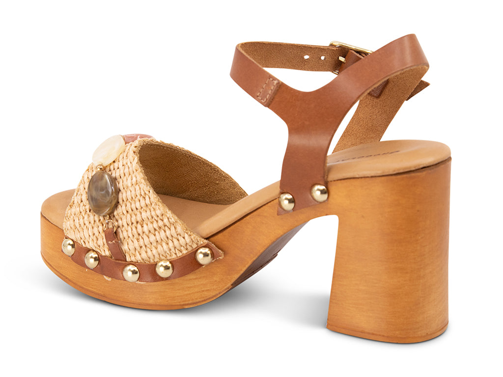 raffia upper sandal with stone details on a wooden platform - view from the back