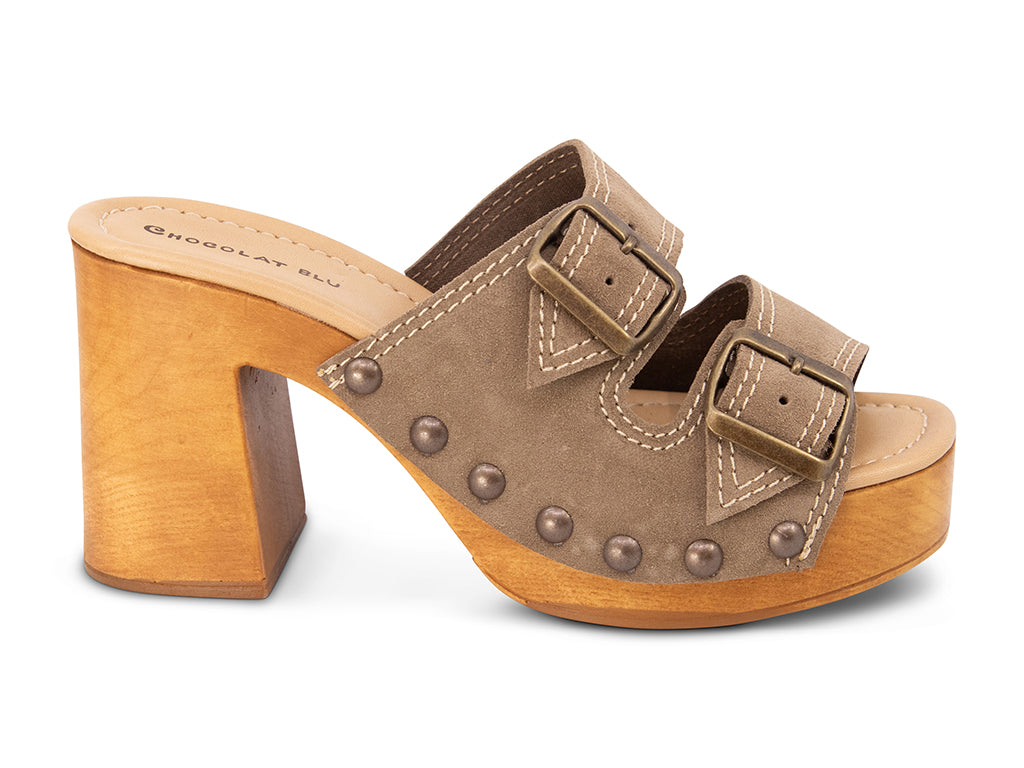 taupe suede slide sandal on wooden platform -side view