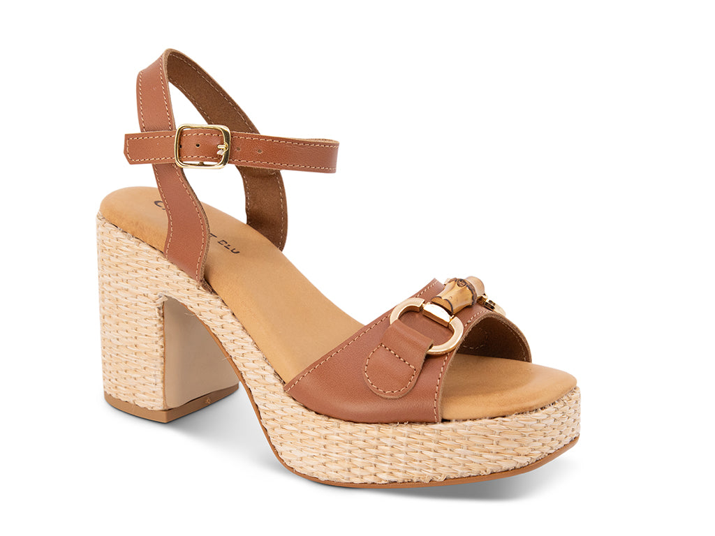 brown sandal with an ankle strap and a raffia wrapped platform
