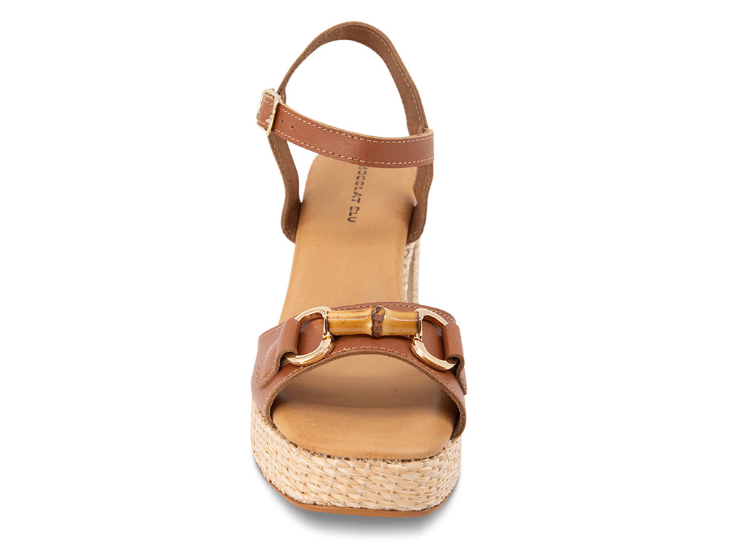 brown sandal with an ankle strap and a raffia wrapped platform - view from the front