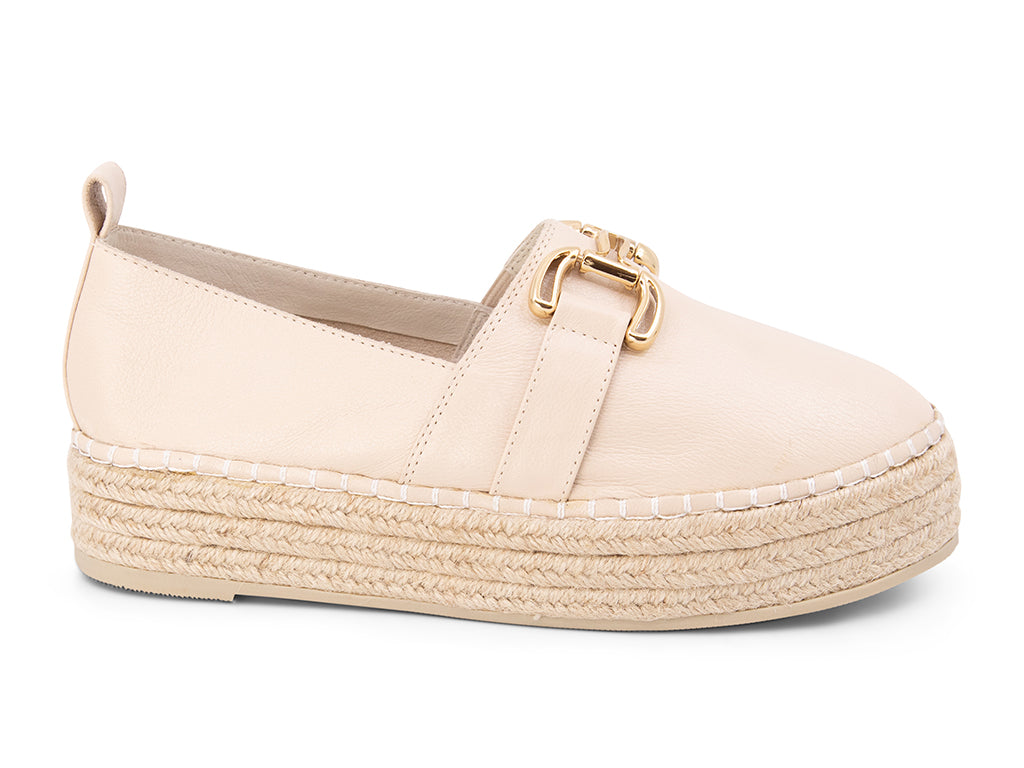cream espadrille flat shoe with a gold buckle - side view