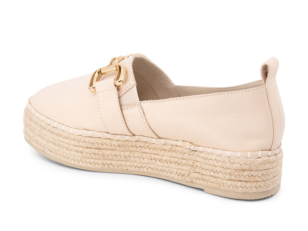 cream espadrille flat shoe with a gold buckle - view from the back