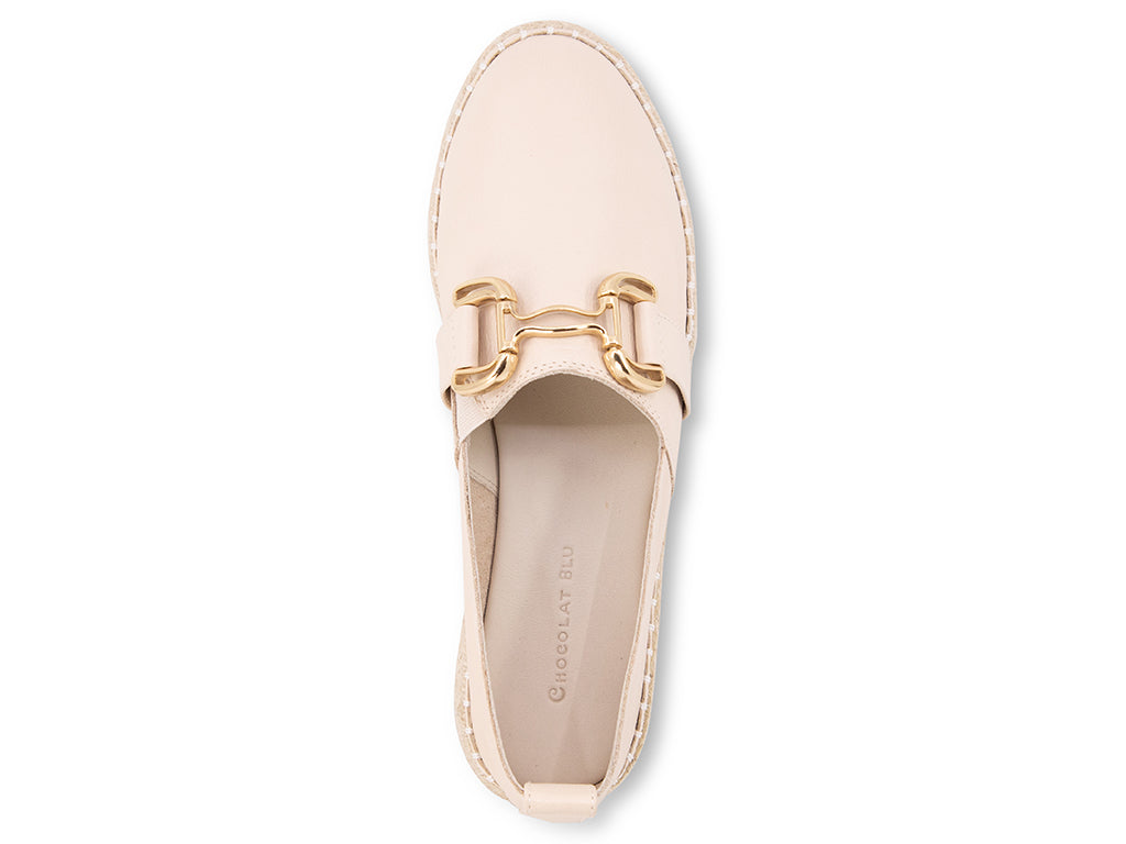 cream espadrille flat shoe with a gold buckle - top view of the upper