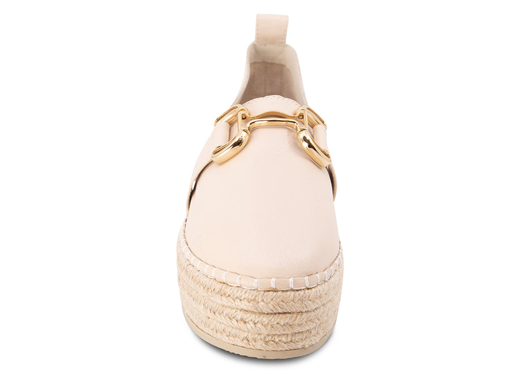 cream espadrille flat shoe with a gold buckle - front view