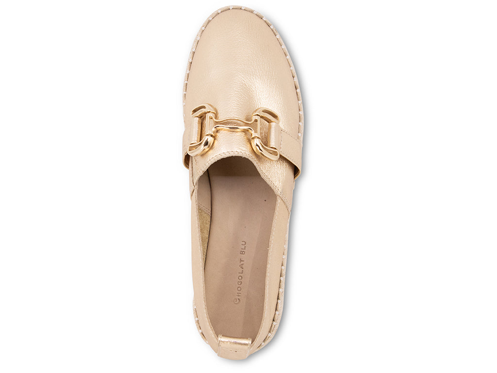 gold espadrille flat shoe with a gold buckle - top view of the upper