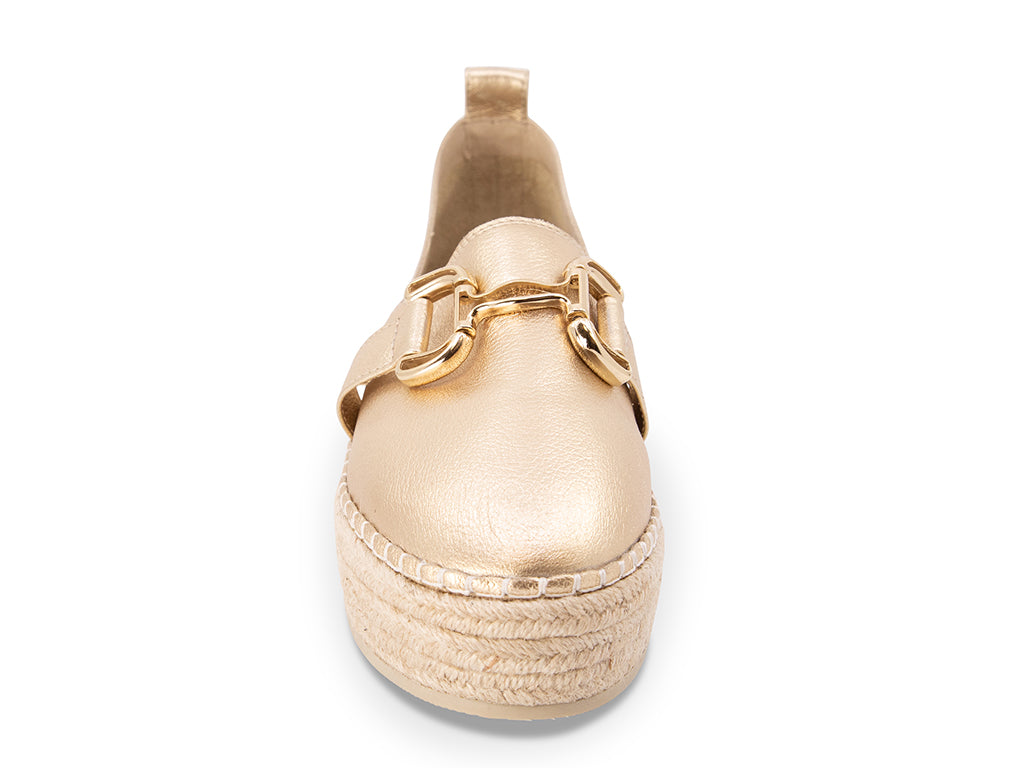 gold espadrille flat shoe with a gold buckle - front view