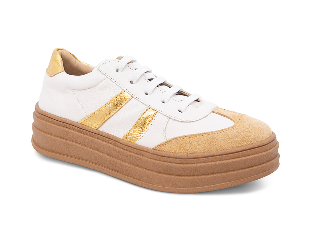White lace up sneaker with a brown sole and gold stripe on a white background side angle view