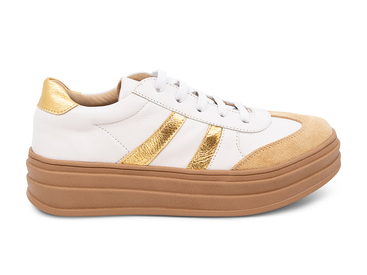 White lace up sneaker with a brown sole and gold stripe on a white background side view