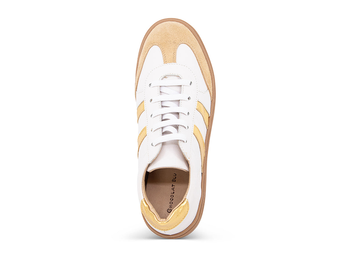 White lace up sneaker with a brown sole and gold stripe on a white background top view