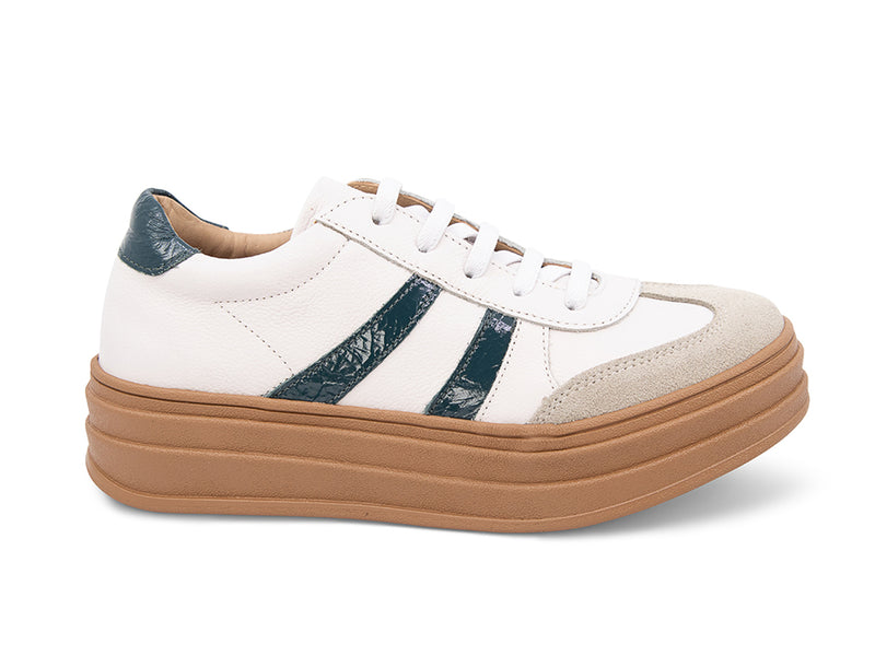 White lace up sneaker with a brown sole and green  stripe on a white background side view