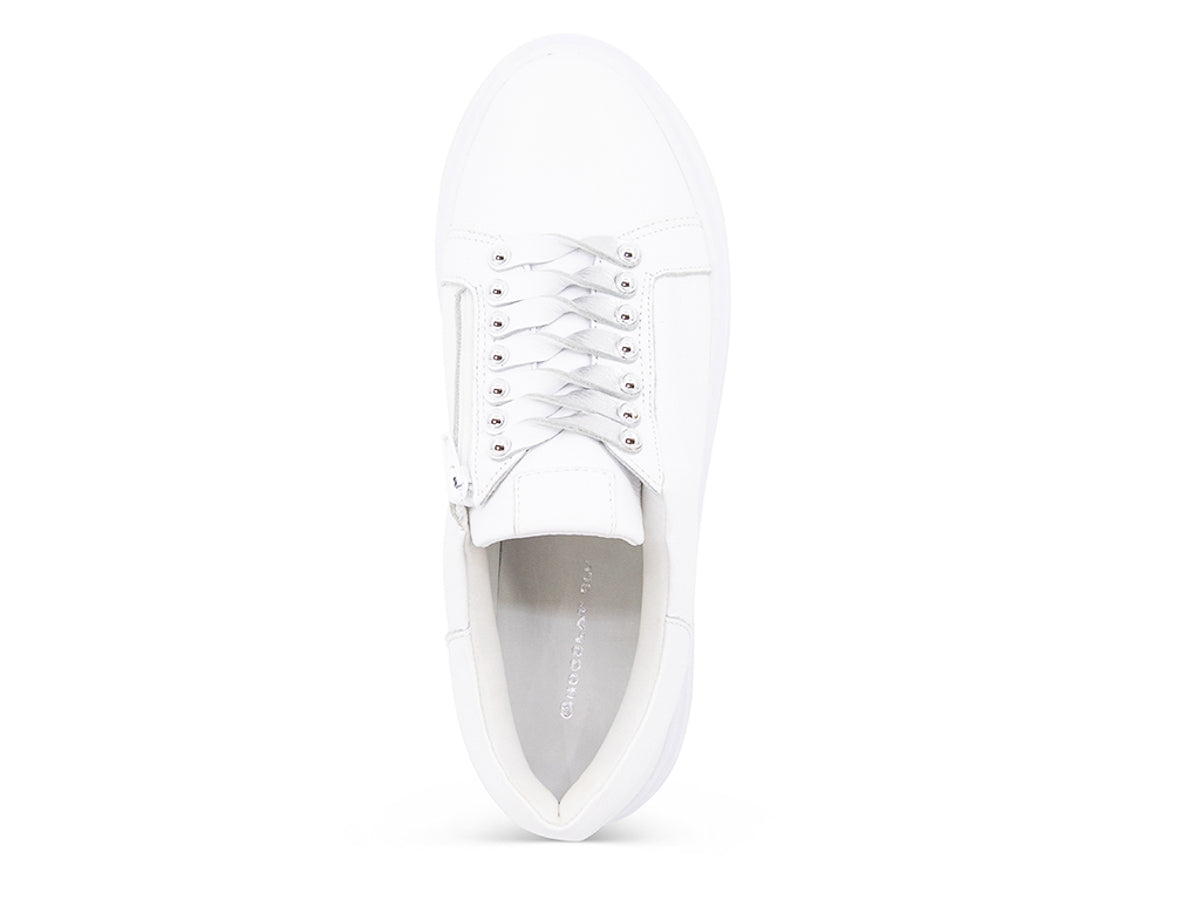 White sneaker with white laces and studs on laces on a white background top view