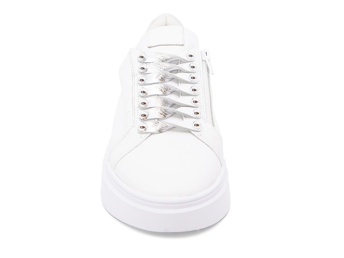 White sneaker with white laces and studs on laces on a white background front view
