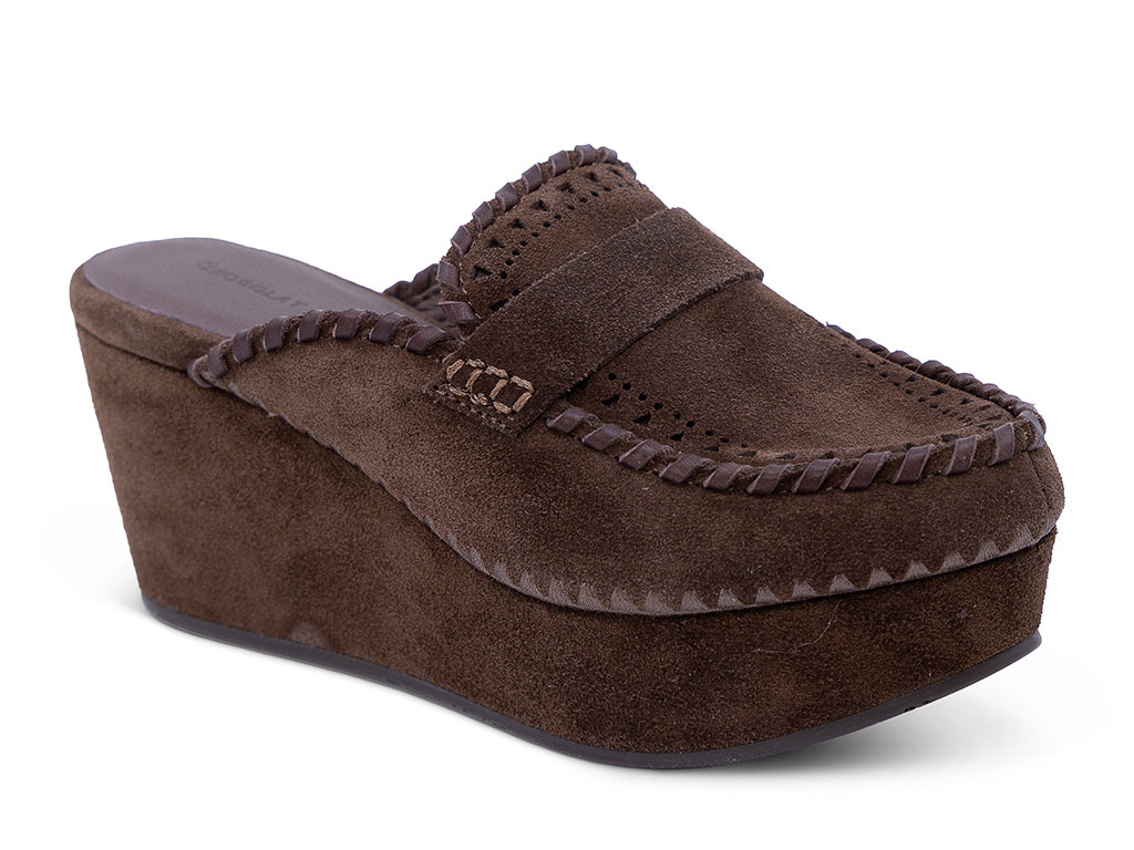A chocolate suede wedge mule with decorative hand-stitched detailing and perforation - front 3/4 view