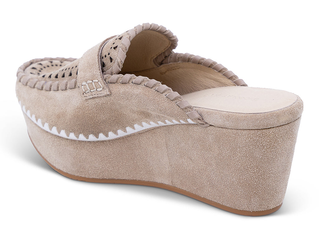 A latte suede wedge mule with decorative hand-stitched detailing and perforation -inner side view