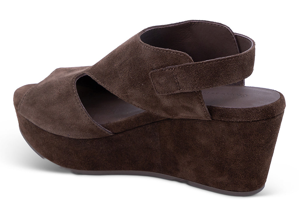 a chocolate suede upper wedge sandal with cut outs and ankle strap -medial side view