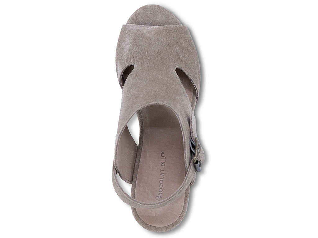 a taupe suede upper wedge sandal with cut outs and ankle strap - top view