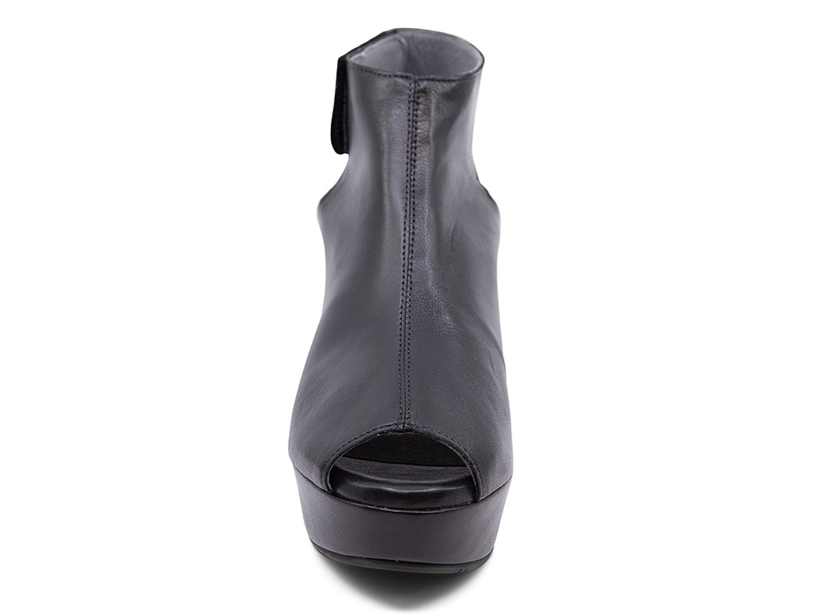 Black leather slide in peep toe wedge platform shoe with ankle velcro strap  on a white background front view