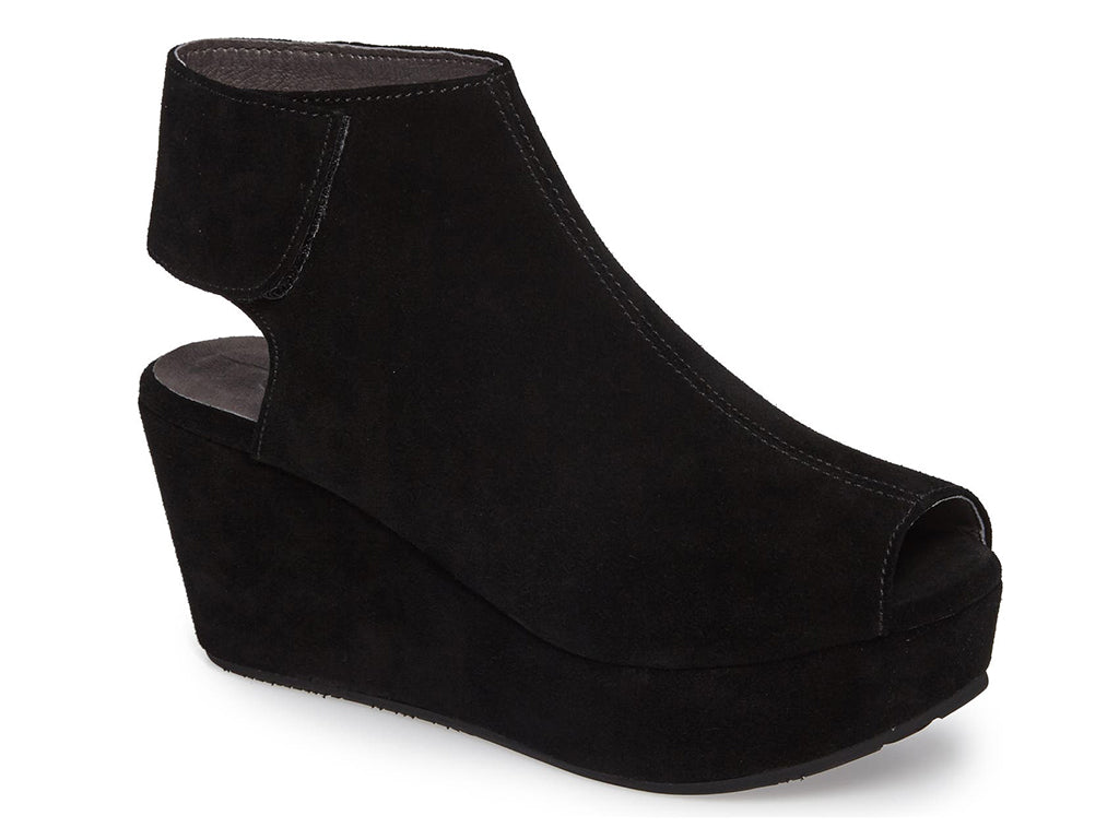 Black suede slide in peep toe wedge platform shoe with ankle velcro strap  on a white background side angle view