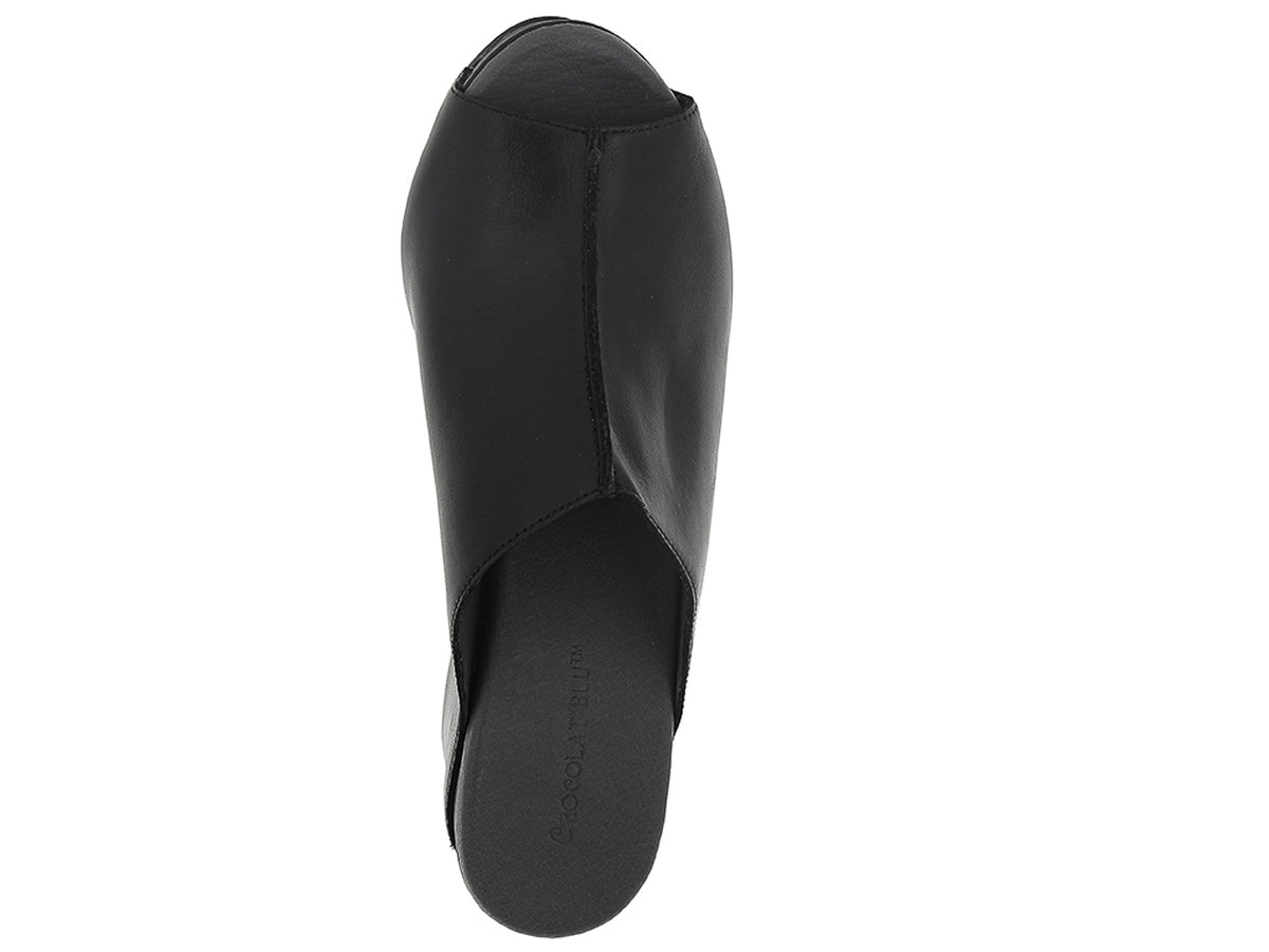 Black leather slide in peep toe wedge platform shoe with exposed seam on upper design on a white background top view