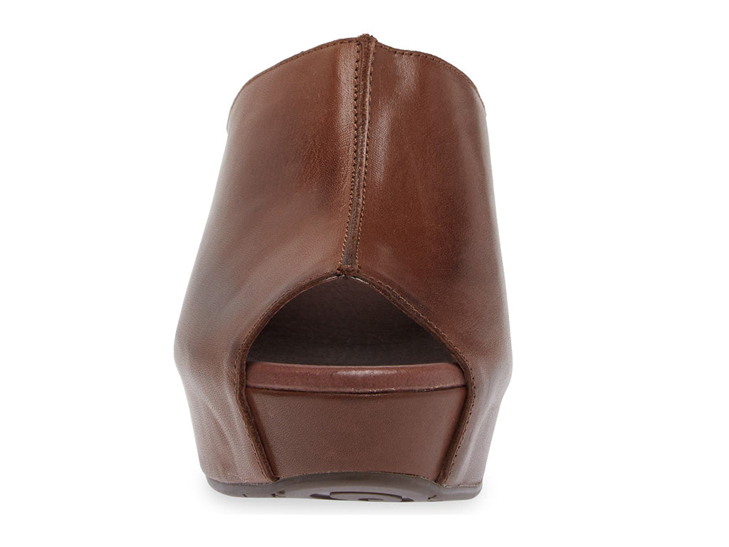 Dark brown leather slide in peep toe wedge platform shoe with exposed seam on upper design on a white background front view