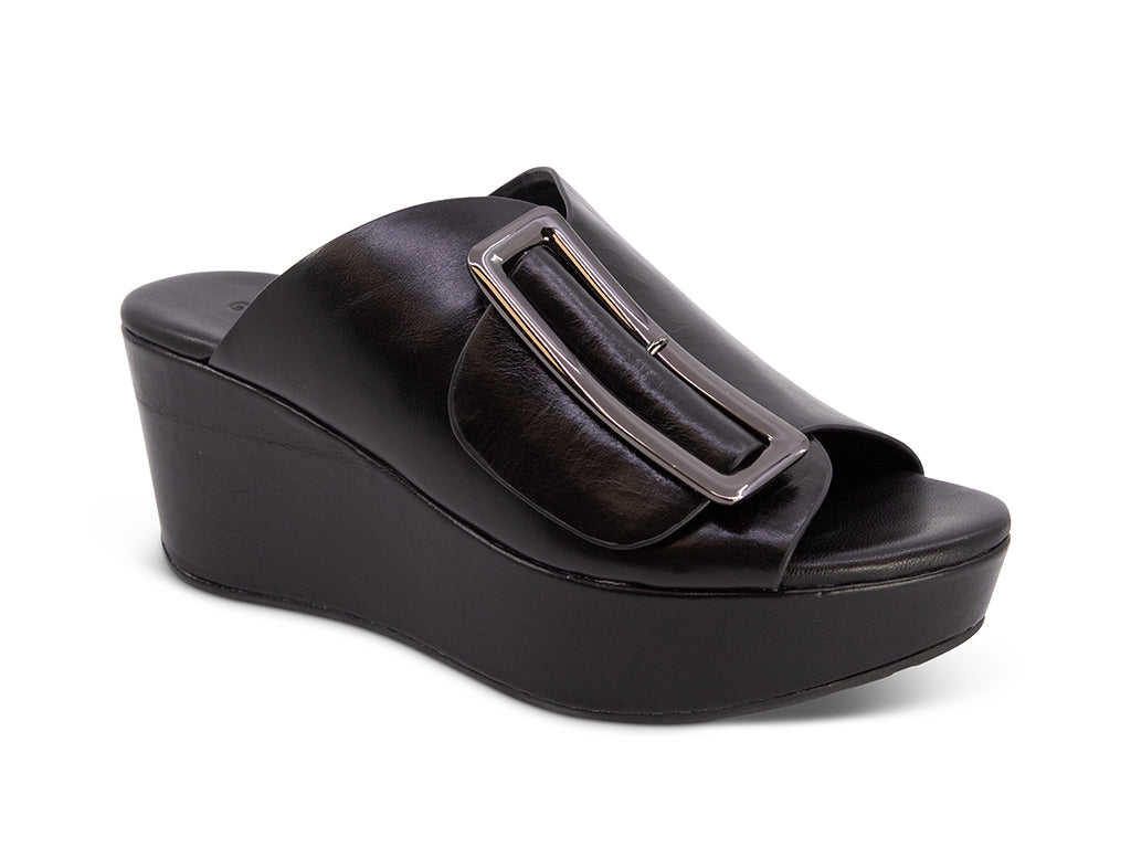 black colored wedge slide sandal with oversized silver buckle