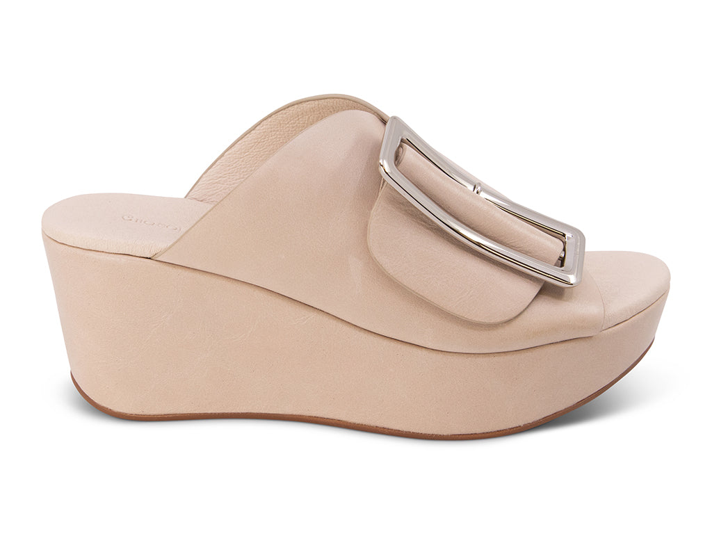 off white colored wedge slide sandal with oversized gold buckle - side view