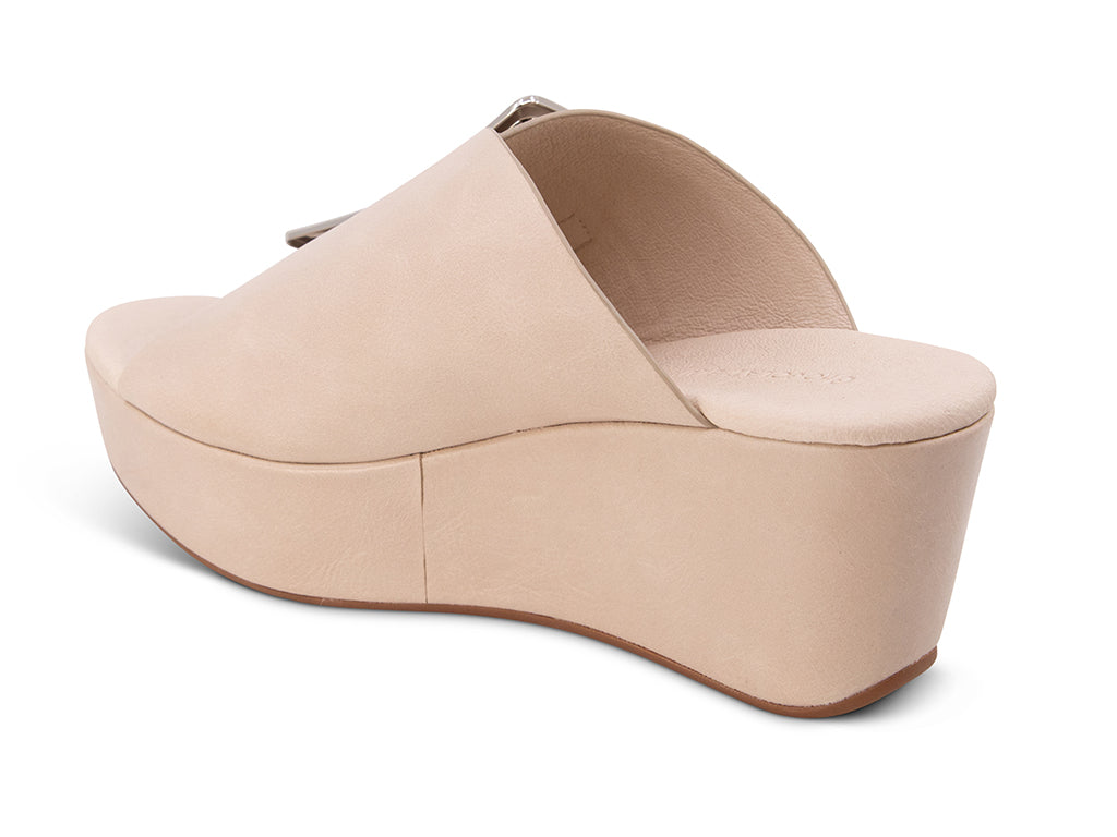 off white colored wedge slide sandal with oversized gold buckle - view from the back angle