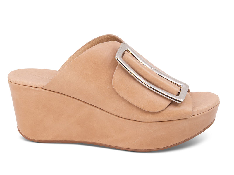 beige colored wedge slide sandal with oversized gold buckle - side view