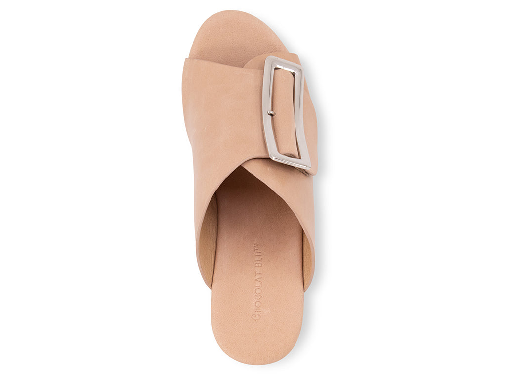 beige colored wedge slide sandal with oversized gold buckle - view of the top of the shoe