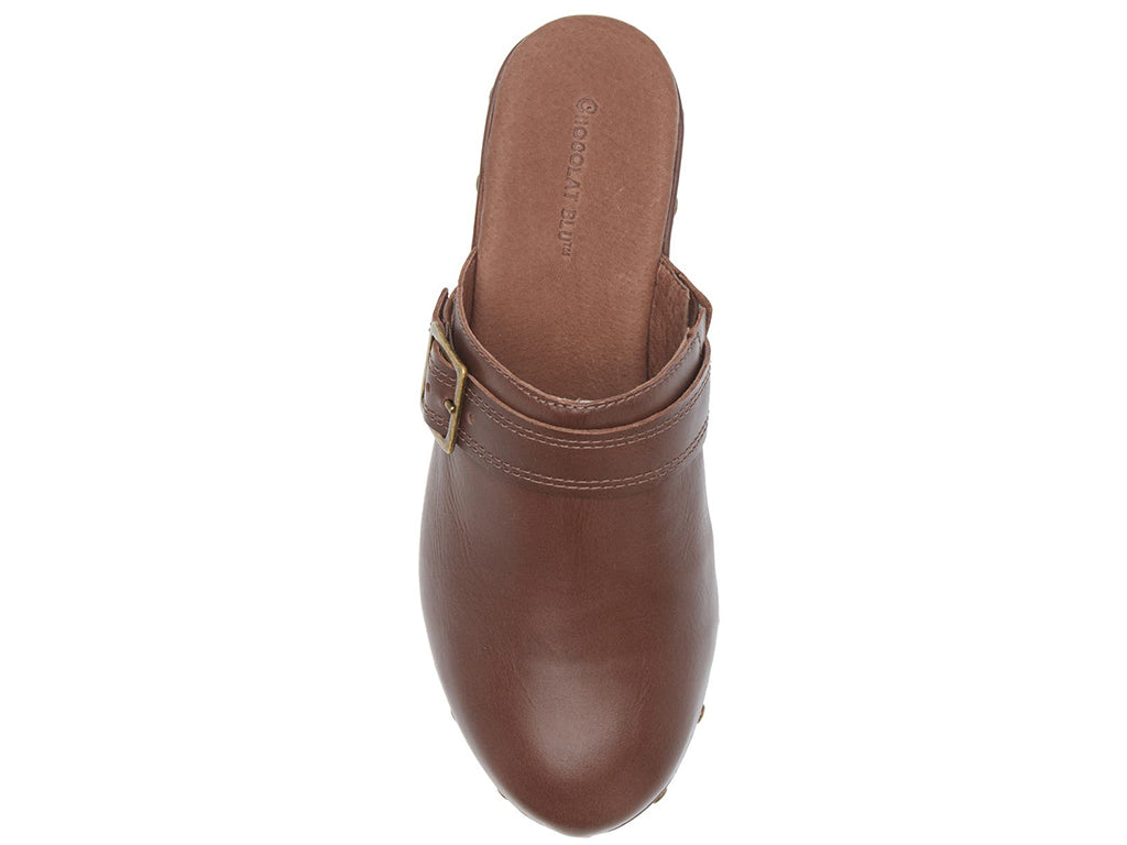 Brown leather slide in clog wedge platform shoe with top strap and buckle decoration and grommet studs on a white background top view