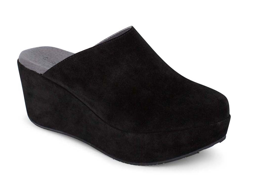 Black suede slide in wedge platform shoe on a white background side angle view