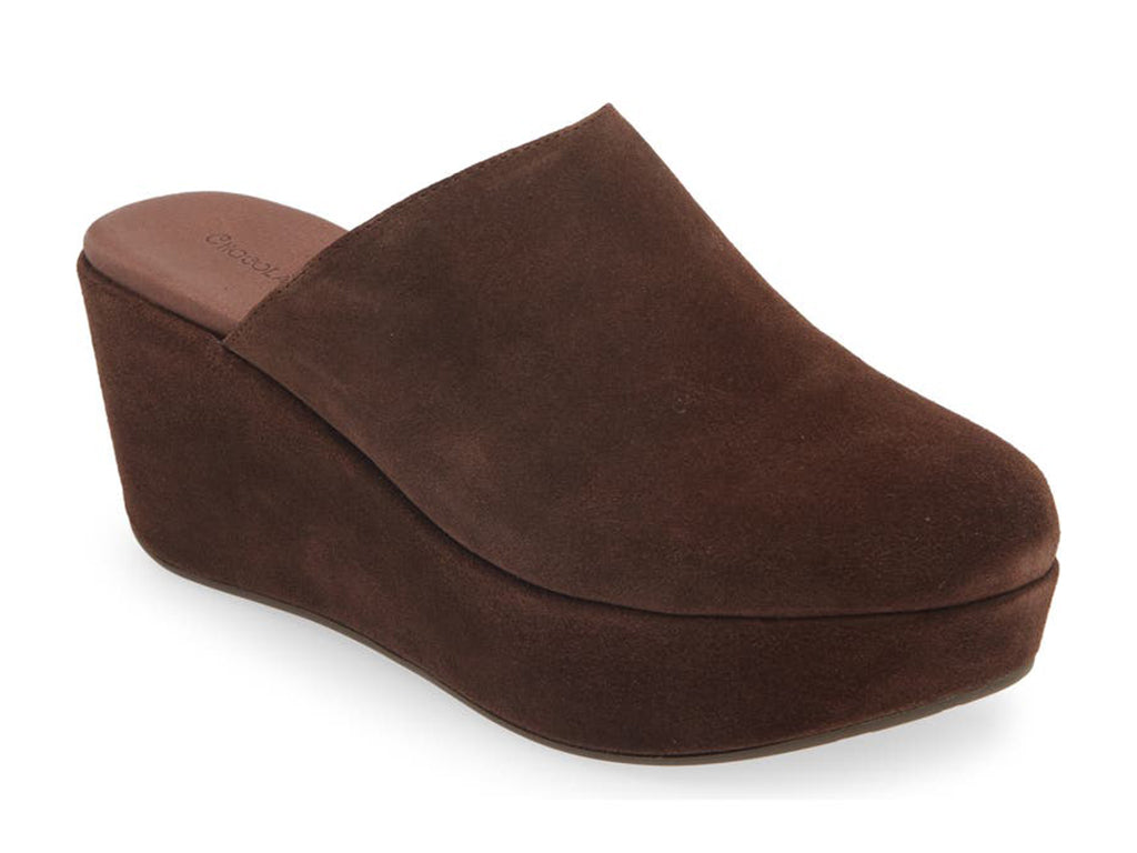Chocolate suede slide in wedge platform shoe on a white background side angle view