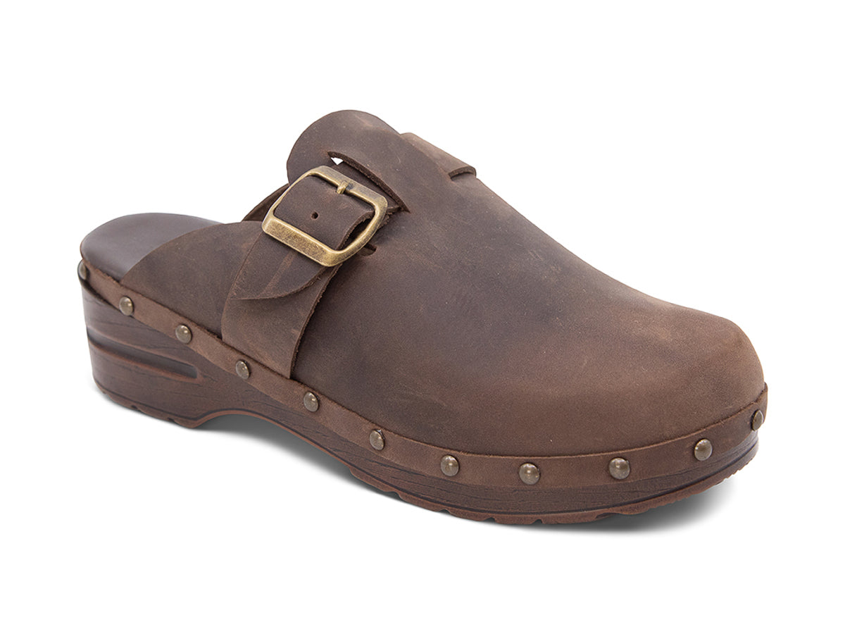 Brown leather clog shoe with a gold buckle and strap  on a white background side angle view