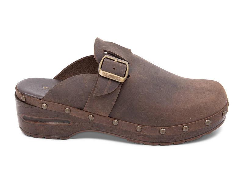 Brown leather clog shoe with a gold buckle and strap  on a white background side view