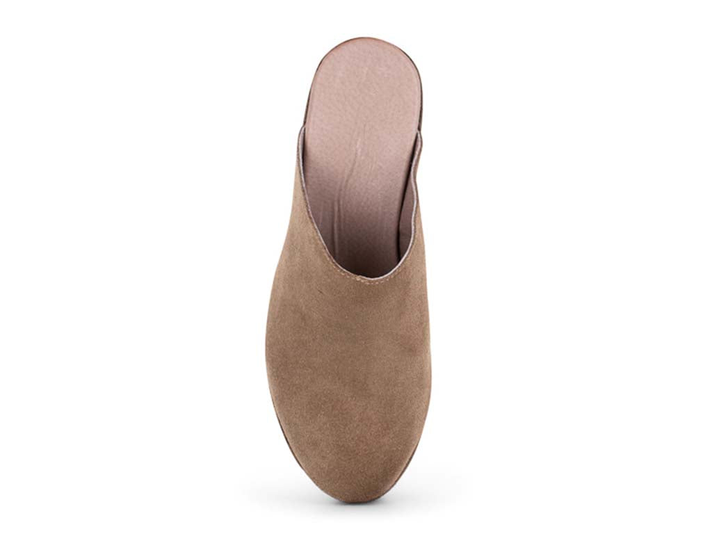 Taupe suede slide in wedge platform shoe on a white background top view